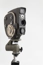 Russia, Krasnoyarsk, December 2019: Soviet cinema camera quartz 2M on a tripod, white background