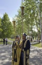 Uzbeks play long brass musical instruments