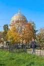 Russia, Kronstadt, September 2020. The huge dome of the Orthodox cathedral among the trees of the old park.