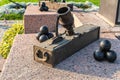 Russia, Kronstadt, September 2020. An old portable cannon with cannonballs at the foot of the monument.