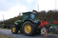 Russia, Leningrad region, May 4, 2019, Russian village. Russian village in the spring and the tractor