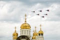 Russia, Magnitogorsk, - July, 19, 2019. Russian attack aircraft Fulcrum-A MiG 29 fly over an Orthodox church