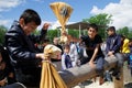 Russia, Magnitogorsk, - June, 15, 2019. The boys are fighting bags on a log during the holiday Sabantuy. National game