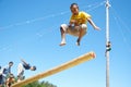 Russia, Magnitogorsk, - June, 16, 2011. Children play national games, jumping on a log, during Sabantuy - the national holiday of