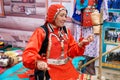 Russia, Magnitogorsk, - June, 15, 2019. An elderly woman demonstrates the work of a manual spinning wheel during the Sabantui