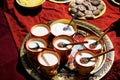 Russia, Magnitogorsk, - June, 15, 2019. Koumiss - mare`s milk spilled over traditional national wooden cups during Sabantuy - a