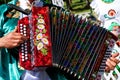 Russia, Magnitogorsk, - June, 15, 2019. A man in national clothes plays the accordion - Tula harmonica. Parade on Sabantuy - the