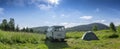 Russia, Mansky district, July 13, 2020: panorama, sky, clouds, hills and mountains. travel by car and autotourism in Russia. tent