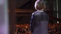 RUSSIA, MOSCOW - APRIL 13, 2019: Woman gives lecture on stage with audience. Art. Successful woman makes speech on