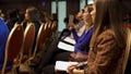 RUSSIA, MOSCOW - APRIL 13, 2019: Women sit on business training with notebooks. Art. Beautiful ladies sit and listen