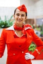 RUSSIA, MOSCOW: 01 AUGUST 2019. Beautiful stewardess dressed in official red uniform Aeroflot Airlines