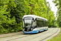 12-06-2019, Russia, Moscow. Blue white Moscow tram modern design of urban transport. The tram goes on rails, summer bright lights