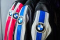 Leather jackets from BMW hanging in a row of red and blue