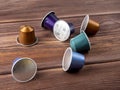 10.03.2021 Russia, Moscow. Bright multi-colored capsules with Nespresso coffee on a brown wooden background. Close up, side view Royalty Free Stock Photo