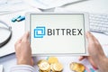 Russia Moscow 05.05.2021.Businessman holding tablet with logo of cryptocurrency stock exchange Bittrex. Buy,sell,change crypto