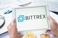 Russia Moscow 05.05.2021.Businessman holding tablet with logo of cryptocurrency stock exchange Bittrex. Buy,sell,change crypto