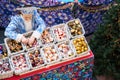 RUSSIA - MOSCOW. 28.12.2018 Christmas market in GUM. Girl in national outfit sells holiday decorations to Christmas tree. View