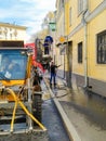 19.04.2021, Russia, Moscow. The city s utilities wash the facades of buildings with high pressure. Royalty Free Stock Photo