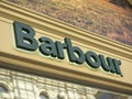 10.04.2021 Russia, Moscow. Close-up of the barbour sign on the store. An English company that produces clothing and shoes