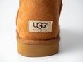 01.05.2021 Russia, Moscow. close-up of the UGG logo on the back of the boot. A well-known American company that produces shoes and