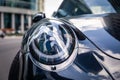 Russia Moscow 2019-06-17 Closeup headlights of new shiny luxury dark blue sports car Porsche 911 parked on street, front bottom