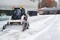 Russia Moscow December 17 2020. Snowplow removes snow on the street in winter editorial