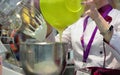 03.14.2019 Russia, Moscow. Exhibition Modern Bakery Moscow. A confectioner kneads a cream using a production machine.