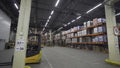 Russia Moscow - February 24, 2022: Large storage room with shelves and boxes. Creative. Lot of shelves and boxes in