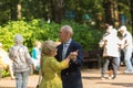 26.07.2020 Russia, Moscow. happy coulpe on the nature. Older people dancing on the dance floor in the summer