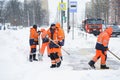 Russia Moscow 13.02.2021 Heavy snowfall,snow winter collapse,blizzard in city.Team of janitors in uniform cleans road