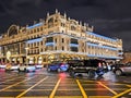 Evening car traffic on Tverskaya Street with evening illumination on buildings