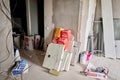 Russia, Moscow - July 05 2020. apartment. Empty construction mix cans and sacks of building materials. Repair process in