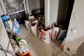 Russia, Moscow - July 05 2020. apartment. Empty construction mix cans and sacks of building materials. Repair process in