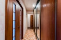 Russia, Moscow- July 06, 2019: interior room apartment. standard repair decoration in hostel. corridor, hallway doors and mirrors