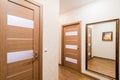 Russia, Moscow- July 08, 2019: interior room apartment. standard repair decoration in hostel. corridor, hallway, doors and mirrors