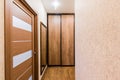 Russia, Moscow- July 08, 2019: interior room apartment. standard repair decoration in hostel. corridor, hallway, doors and mirrors