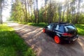 Russia, Moscow - June 01, 2019: Black Volkswagen Golf Mk6 tuned with ragtop and orange wheels. Stance tuning on air suspension in Royalty Free Stock Photo