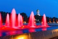 Fountains with red lights in Victory Park Poklonnaya Gora. Night illumination, summer evening in the city. Background - Church of Royalty Free Stock Photo