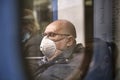 Russia Moscow June 2020. Moscow metro. a man in a protective mask rides in a subway car. view from the next car. coronavirus