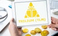 Russia Moscow 05.05.2021. Man holding tablet with logo of token Trilium TLM. Gaming platform Alien Worlds.Crypto coins WAX,mining