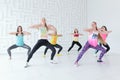 RUSSIA, MOSCOW, 2017 - MARCH 12: Group of happy young women wearing sportswear dancing at Zumba dance fitness class Royalty Free Stock Photo