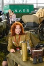 Russia, Moscow, March 8, 2020. A red-haired woman in a Soviet officer uniform