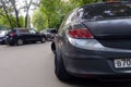 Russia, Moscow - May 04, 2019: Gray metallic Opel Astra modified to Stance style. Car with big custom steel wheels parked on the