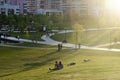 Russia, Moscow - 15 May 2021: Khodynka field, Park and residential area. People relax in the city Park at sunset on a