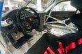 Russia, Moscow - May 06, 2019: Racing cockpit of Porsche 911 GT3 Cup. Interior of premium super car with safety cage and carbon