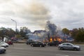 Russia, Moscow, Mytishchi, October 1, 2014 - the Yaroslavl highway, M8, work to expand the road, the house is burning, the fire