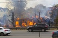 Russia, Moscow, Mytishchi, October 1, 2014 - the Yaroslavl highway, M8, work to expand the road, the house is burning, the fire
