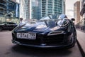 Russia Moscow 2019-06-17 New shiny luxury dark blue sports car Porsche 911 parked on street, front bottom view on bonnet, bumper,