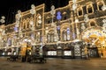 04/01/2020 Russia, Moscow. Night Christmas illumination in the view of light garlands on the facade of the historical building of