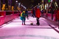 Russia, Moscow, Novy Arbat, December 19, 2018 - Curling ground, people play ice in the winter game. Winter, night and snow. New